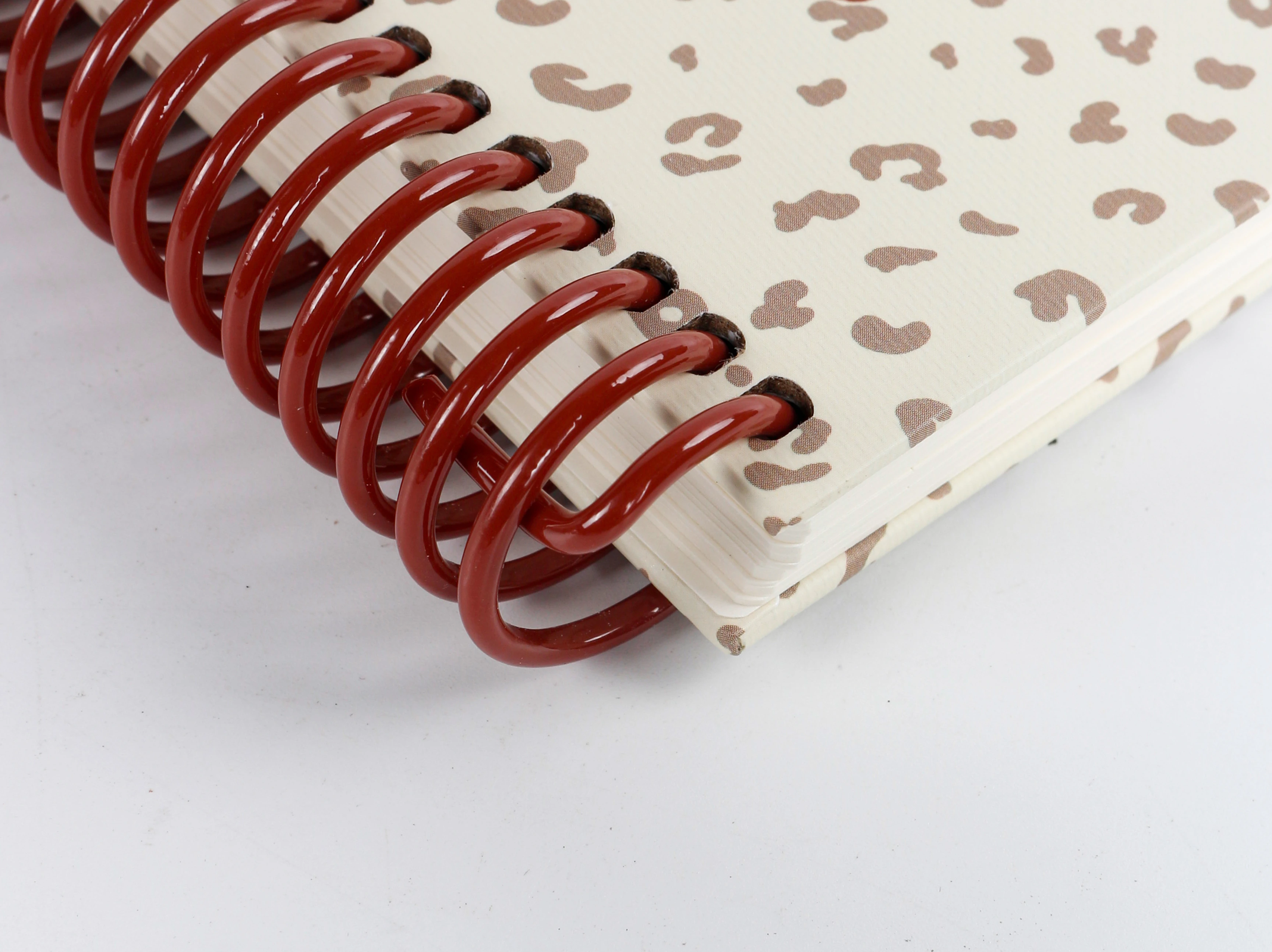 Safety 270℃end bend detail on pre-cut wire-o binding for child-safe custom branded notebooks